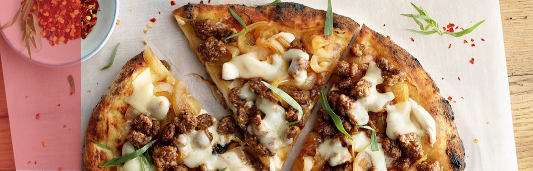 pizza slices topped with plant-based alternative meats